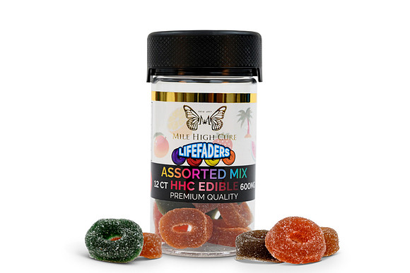 White-background product photograph of Mile High Cure assorted HHC ring edibles with gummies arranged in front.