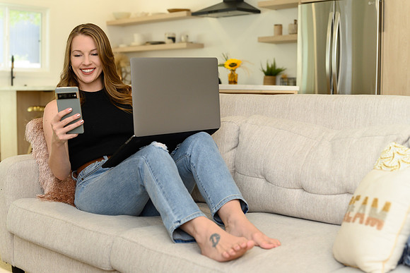 woman-working-from-sofa-with-laptop-los-angeles