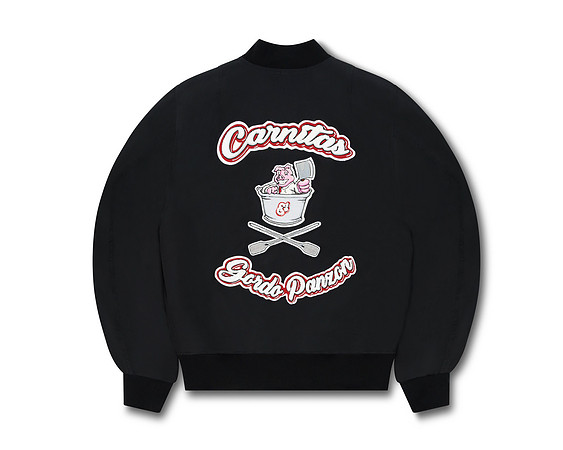 Apparel product photograph of a black bomber jacket showing embroidered artwork and lettering on the back.