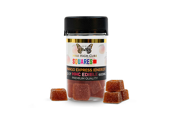 White-background product photograph of Mile High Cure Mango Express HHC edible squares with several gummies in front.