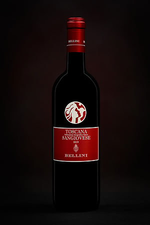 Studio product photograph of a Bellini Toscana Sangiovese wine bottle against a dark background.