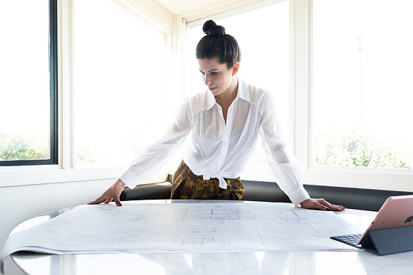 designer-leaning-over-floor-plans-los-angeles