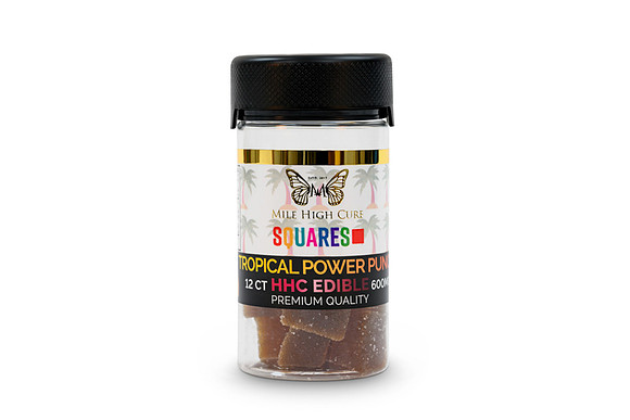 White-background product photograph of Mile High Cure Tropical Power Punch HHC edible squares in a clear jar.