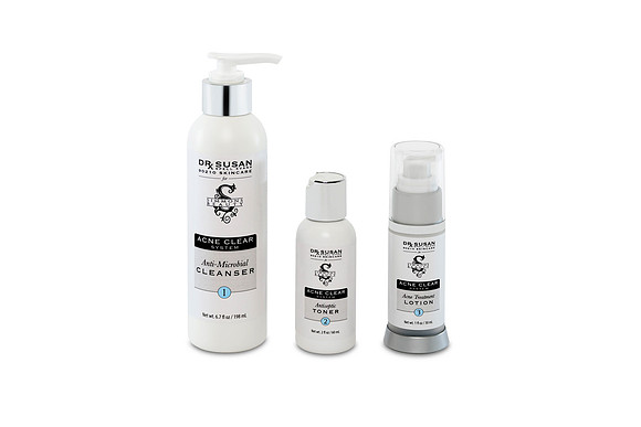 White-background group product photograph of three Acne Clear System skincare bottles.