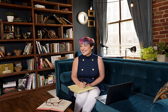 woman-seated-in-library-with-laptop-los-angeles